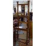 An Edwardian oak mirror-back hall stand, W69cm