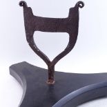A 19th century cast-iron boot scraper, on large later black marble tri-form base, overall height