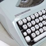 A Hermes Baby Portable Typewriter, barrel length 24cm
