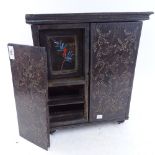An Oriental stained hardwood table-top cabinet, ivory inlay with reverse painted glass panel, height