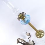 A brass oil lamp with blue glass font, and a 5-branch hanging chandelier, lamp height excluding