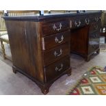 An Edwardian mahogany knee-hole writing desk, with 9 short fitted drawers (loose top), W144cm