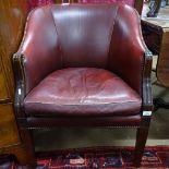 An Edwardian studded leather upholstered desk chair
