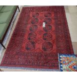 A red ground Turkemon rug, 230cm x 160cm