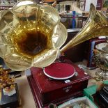 A reproduction Victrola twin brass-horn gramophone, base width 45cm