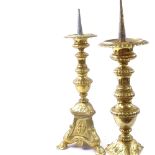 WITHDRAWN - A pair of cast-brass pricket candlesticks, relief embossed religious portraits and