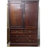 An Arts and Crafts mahogany 2-section linen press, with fitted slides and drawers under, W126cm