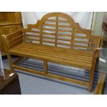 A slatted teak Lutyens design garden bench