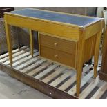 A mid-century teak desk/vanity table by Uniflex, rising lid revealing a part fitted interior, with 2