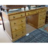 An Antique pine twin-pedestal writing desk, with leather skiver and fitted drawers, W152cm