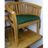 A pair of good quality teak bow-arm garden chairs and cushions