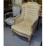 A Continental painted open arm bedroom chair, and a limed oak effect upholstered armchair