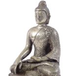 A Chinese cast white metal seated Buddha on double lotus base, height 14cm