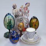 St Petersburg cup, saucer and plate, Russian eggs, and a Ukraine figure group, 23.5cm