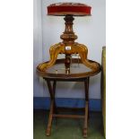 A Victorian walnut revolving piano stool, and a Victorian oval 2-handled tea tray on stand