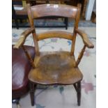 A Victorian Windsor kitchen elbow chair with elm seat