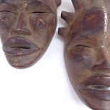 2 Antique African Tribal carved hardwood masks, largest height 40cm (2)