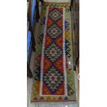 A red ground Kilim runner, 200cm x 58cm