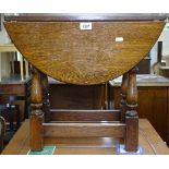 An oak drop leaf swivel-top occasional table, W54cm