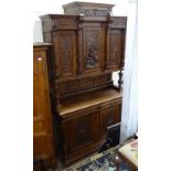An Antique French carved and panelled oak 3-section buffet, W140cm, H238cm