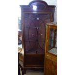 A late Victorian mahogany and satinwood-banded corner display cabinet, with lattice glazed