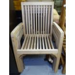 A set of 4 teak slatted garden armchairs