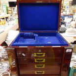 A Victorian mahogany canteen box in the form of a Wellington chest, with 4 short fitted drawers,