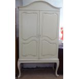 A Continental cream painted 2-door cabinet on stand, W125cm