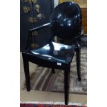 A Louis Ghost gloss black armchair, by Philippe Starck for Kartell