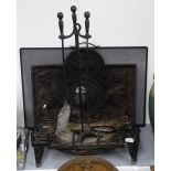 An 18th century embossed cast-iron arch-top fire back, with heraldic decoration, a duck's nest