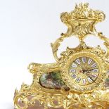 A modern brass quartz mantel clock, on shaped agate base, base length 40cm