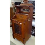 A Victorian mahogany coal purdonium, with a raised mirror and drawer back and acanthus leaf carved