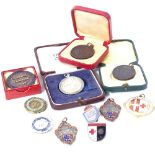 Various nursing and life saving badges and medals, including some silver and enamel