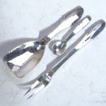 A Georg Jensen Danish silver Kugle beaded caddy spoon, matching salt spoon and pickle fork (3)