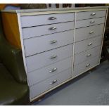 A mid-century formica covered chest of 12 drawers, W117cm