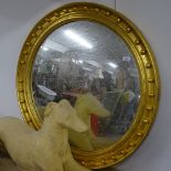 A large giltwood-framed convex wall mirror, W98cm