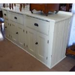 An early 20th century painted pine dresser base, with drawers and panelled cupboards, L166cm