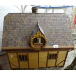 A child's doll's house and furniture, with matching barn