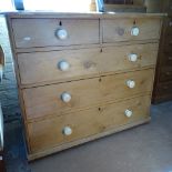 A Victorian pine 5-drawer chest with ceramic handles, W105cm, and a small 3-tier open bookcase,