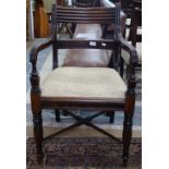 A George III mahogany desk chair, with cross stretchers and turned legs