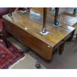 A Regency mahogany Pembroke table, with end frieze drawer, raised on turned centre column, sabre leg