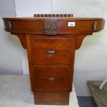 An unusual oak side table, with oval top and 2 central drawers, W76cm