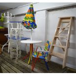 A child's painted garden table and folding chair, a miniature painted hat and coat stand, a