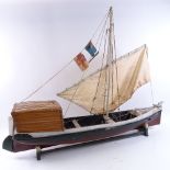 A Vintage handmade painted wood-hulled model boat, hull length 88cm