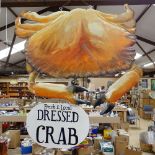 A large handmade carved and painted wood Fresh and Local Dressed Crab Fishmonger's hanging sign,