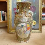 An Oriental vase with applied lizards and figure decorated panels, height 61cm
