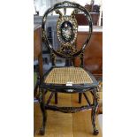 A Chinese design black lacquered and painted side chair, with cane seat