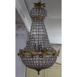 An Empire style brass-framed hanging ceiling chandelier, height 80cm