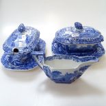 A pair of Spode Italian pattern sauce tureens and covers on stands, and matching sauce boat
