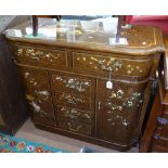 An Oriental design brown lacquered side cabinet, with fitted drawers and cupboards, with gilded